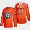 men jets connor hellebuyck indigenous warmup 2022 wasac night orange jersey